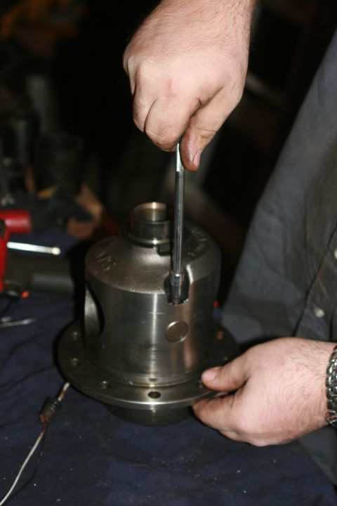 1990 Ford Bronco - Disassembly: Remove cross pin retainer bolt.