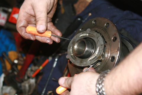 1990 Ford Bronco - Take a couple of pics and remove the lower part of the ball ramp assembly.