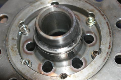 1990 Ford Bronco - Here are the springs sitting in the carrier. At this point inspect the bores that the pins were removed from for scoring, galling, or other…