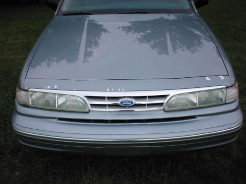 1997 Ford Crown Victoria - Front view of a 1997 Ford Crown Victoria, showing the grille and headlights.