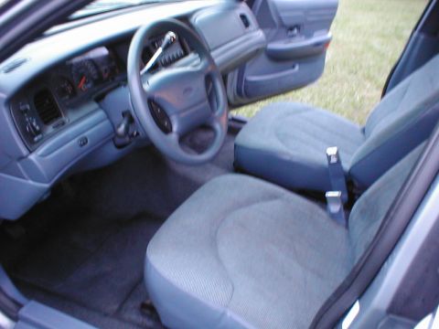 1997 Ford Crown Victoria - The interior of a 1997 Ford Crown Victoria is shown, the driver's side dashboard and front seating area.