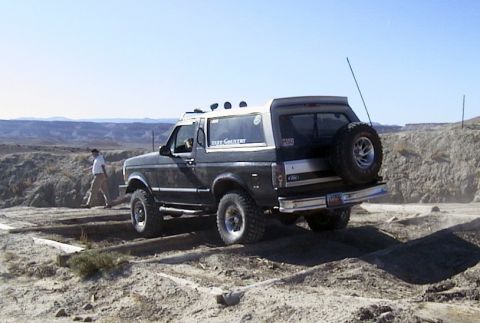 1994 Ford Bronco - This 1994 Ford Bronco is shown off-road with a spare tire mounted on the rear.