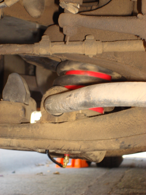 1983 Ford Bronco - ok- getting the new bag in was some work. i put some wheel bearing grease on the lower control arm to assit getting the bag in. then get ou…