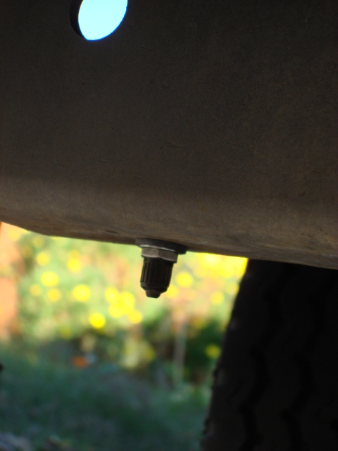 1983 Ford Bronco - i did not like the original spot so i found a new spot on the front sub frame. here is the completed install on the pass side.