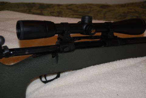 1991 Ford Bronco - A rifle with a scope is shown in detail.