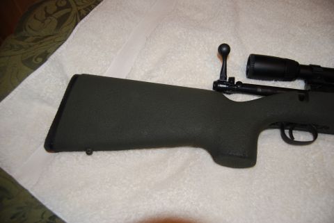 1991 Ford Bronco - Close-up view of a rifle's stock and attached scope.