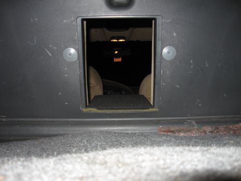 1992 Ford Crown Victoria - Interior of a 1992 Ford Crown Victoria visible through an opening, revealing seats and dashboard details.