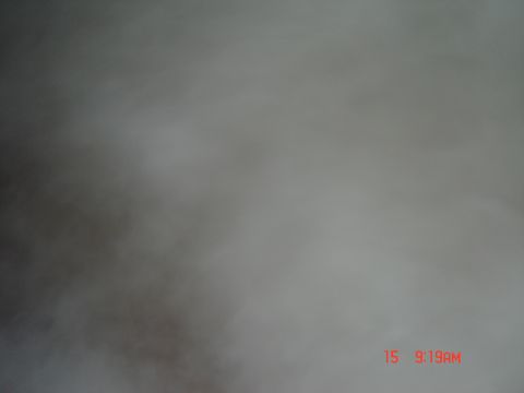 1998 Ford Crown Victoria - The image shows abstract blurry shapes with a timestamp in the corner, not a discernible vehicle.