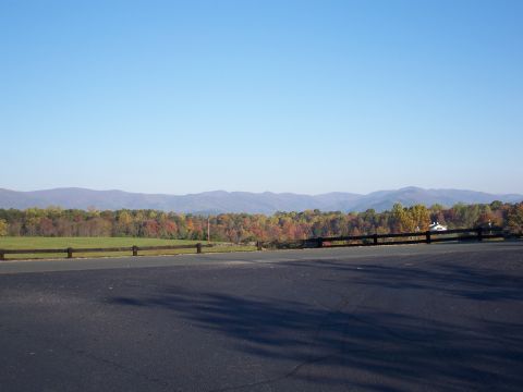 1971 Ford Ranchero - A scenic view of rolling hills and colorful autumn foliage under a bright blue sky.
