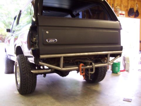 1983 Ford Bronco - The rear of a 1983 Ford Bronco is shown, a custom bumper and tailgate.