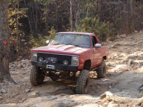 1978 Ford Bronco - This modified pickup truck navigates a challenging off-road course.