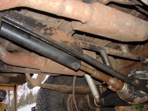 1979 Ford Bronco - Close-up of the undercarriage, focusing on mechanical components like the suspension and exhaust system.