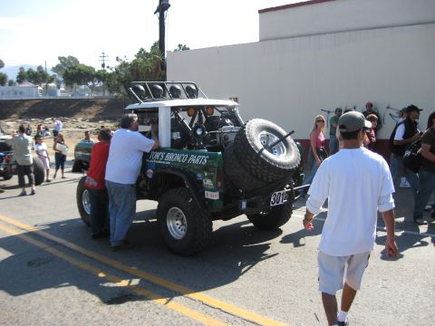 1994 Ford Bronco - This modified 1994 Ford Bronco, branded "Tom's Bronco Parts," is seen from the rear with its spare tire mounted externally.