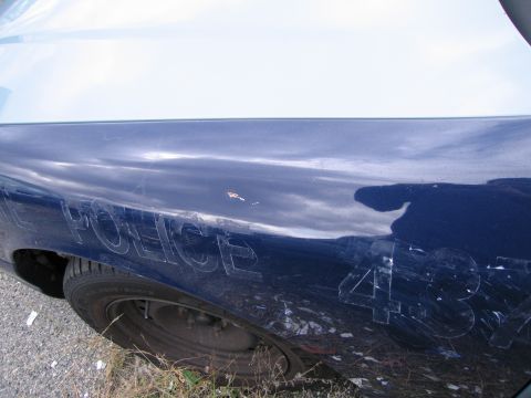 1991 Ford LTD Crown Victoria - Side view of a 1991 Ford Crown Victoria LTD police car fender showing the word POLICE and the number 437.