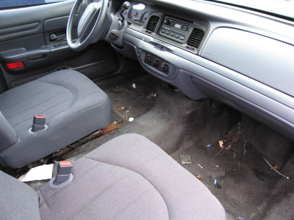 Interior of a 1991 Ford Crown Victoria LTD showing front seats, dashboard, and steering wheel