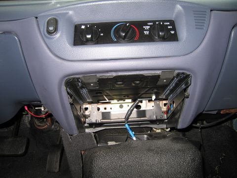 1991 Ford LTD Crown Victoria - Interior view of a 1991 Ford Crown Victoria LTD, showing the climate control panel and an empty space where the radio would be.