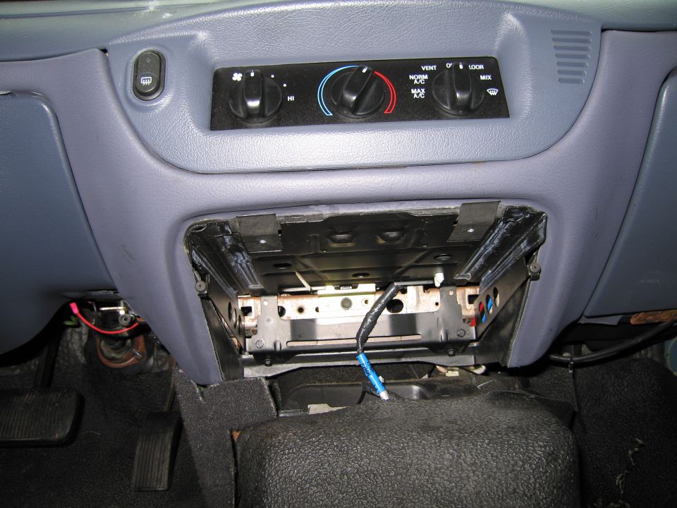 1991 Ford Crown Victoria LTD interior dashboard with climate controls and an open radio slot