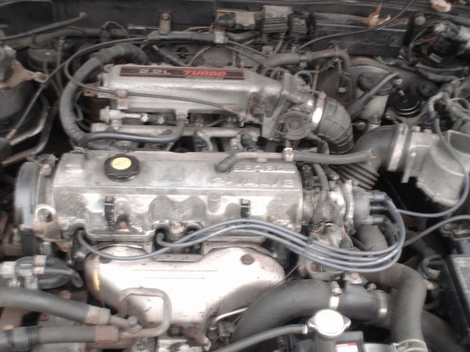Engine bay with 2.2L TURBO intake manifold and 16-VALVE cylinder head