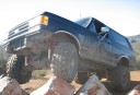 1989 Ford Bronco - 1989 Ford Bronco navigating rocky terrain off-road.