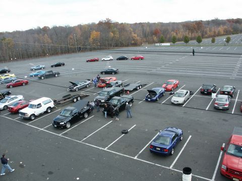 2001 Mercury Grand Marquis - A 2001 Mercury Grand Marquis is among many cars parked in an outdoor lot.