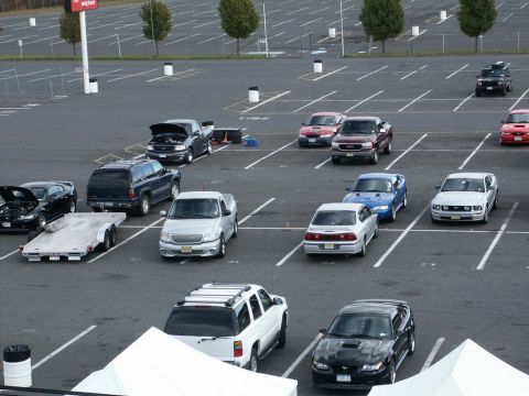 2001 Mercury Grand Marquis - A parking lot scene shows numerous vehicles, including trucks and cars, parked in designated spots.