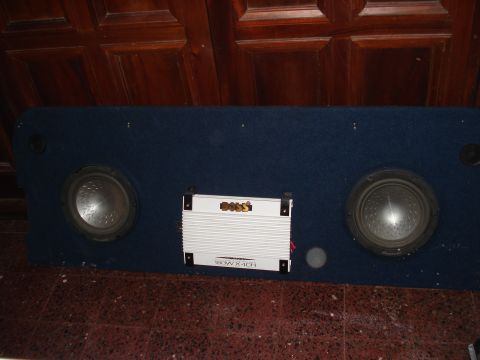 1986 Ford Bronco - A car audio subwoofer box with two speakers and a BOSS amplifier is shown.