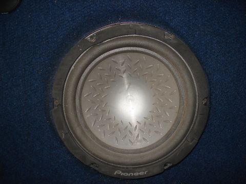1986 Ford Bronco - A Pioneer subwoofer is visible, mounted in blue carpeting.