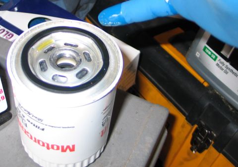 1994 Ford Bronco - A new Motorcraft oil filter is shown next to a bottle of synthetic motor oil.