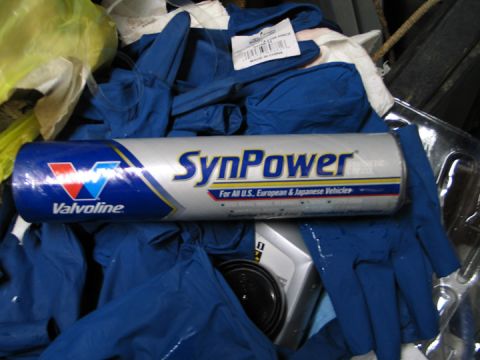 1994 Ford Bronco - A Valvoline SynPower oil container is shown resting on a pile of blue gloves.