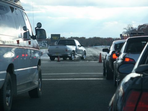 2001 Mercury Grand Marquis - A silver pickup truck is lined up at a drag strip, with other vehicles waiting in line.