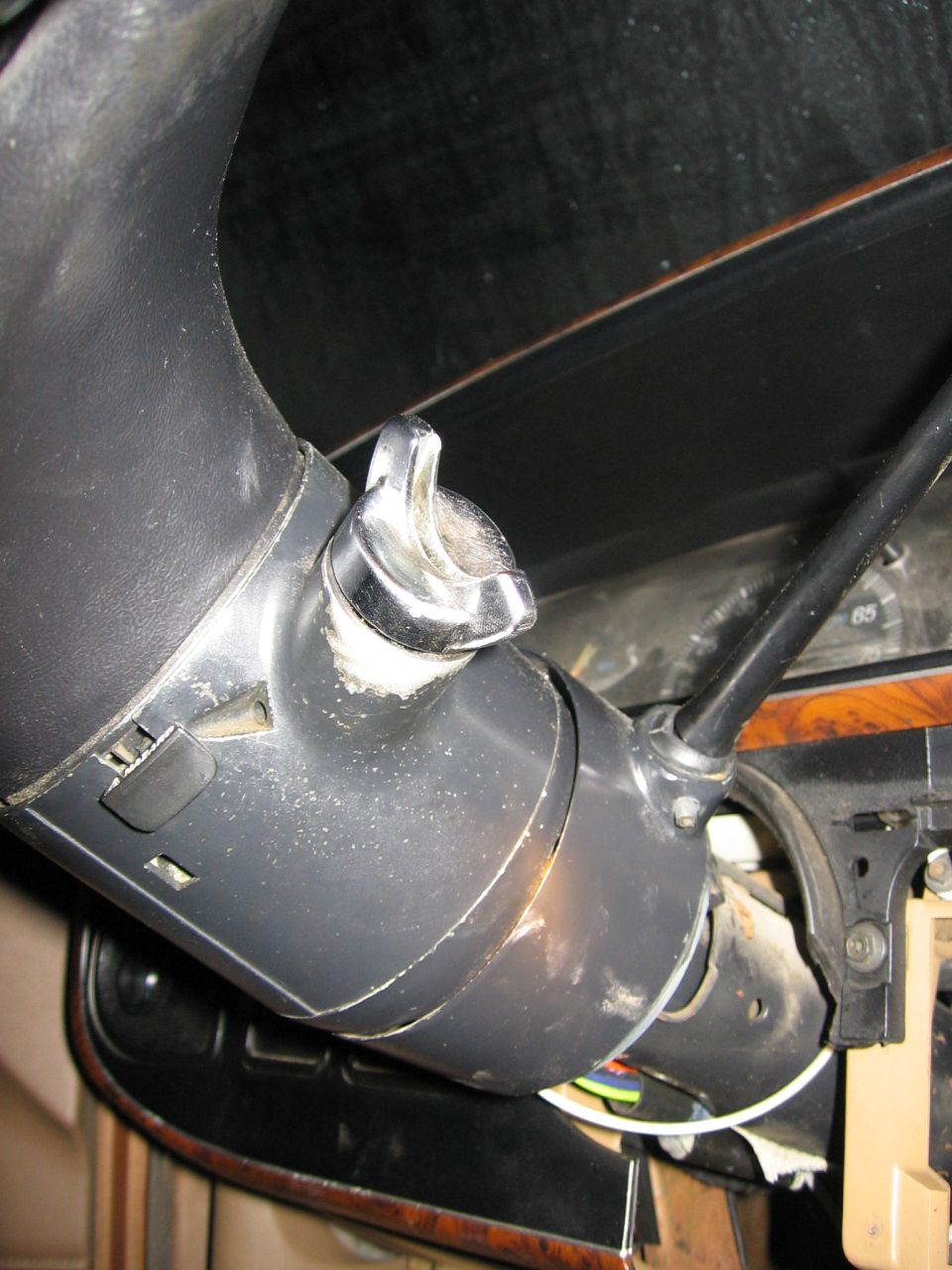 Steering column ignition switch with chrome knob and black plastic housing