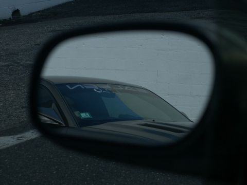 2001 Mercury Grand Marquis - A car's windshield banner is visible in the reflection of a side mirror.