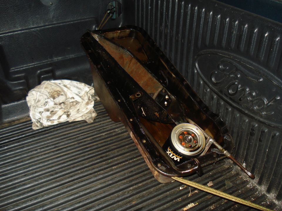 Oil pan and Wix oil filter in the bed of a Ford truck