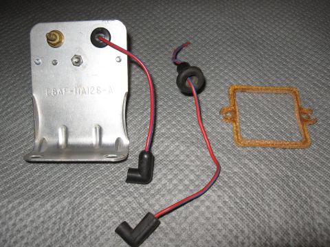 1968 Shelby GT500 - A starter delay relay with associated wiring and a gasket are laid out on a textured gray surface.