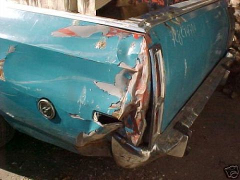 1972 Ford Ranchero - The rear of a teal 1972 Ford Ranchero shows significant damage to the quarter panel and bumper.