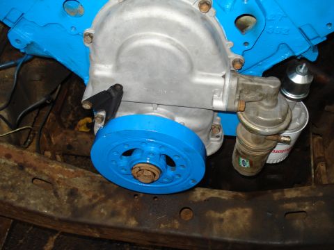 1967 Ford F-250 - Close-up of an engine component with a blue pulley and fuel pump assembly.