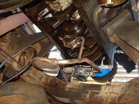 1967 Ford F-250 - Close-up view of the internal engine components, including the crankshaft and oil pan.