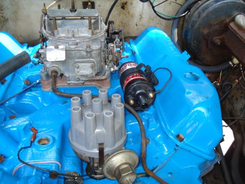 1967 Ford F-250 - Close-up view of engine components including a carburetor and distributor.