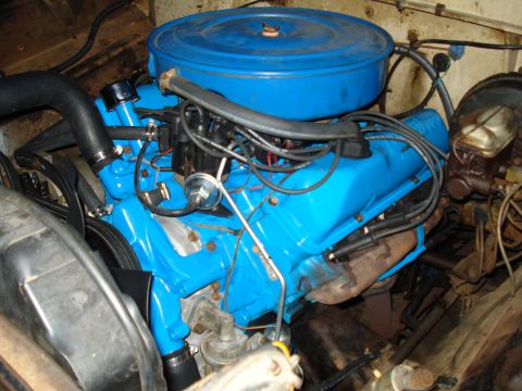 1967 Ford F-250 - Close-up view of a vehicle's engine compartment, showing the engine block and associated components.