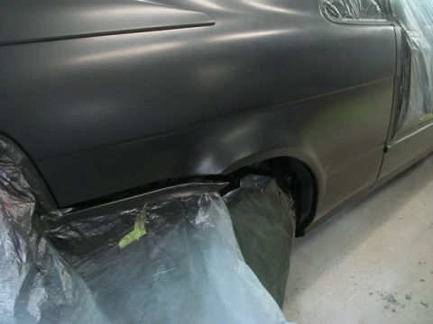 1996 Ford Bronco - Car bodywork covered in plastic sheeting, ready for paint application.