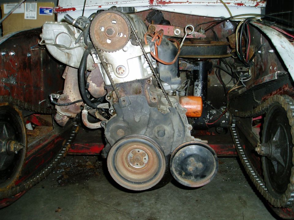 Engine and track system with drive sprockets and timing belt