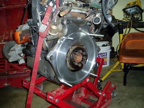 2000 Ford E350 - Engine component assembly on a stand, likely in a garage or workshop setting.