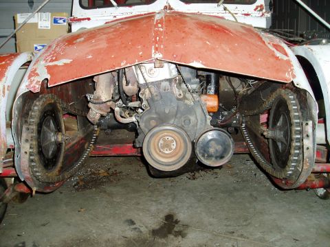 2000 Ford E350 - Custom tracked vehicle with engine exposed, showing drive chains and mechanical components.