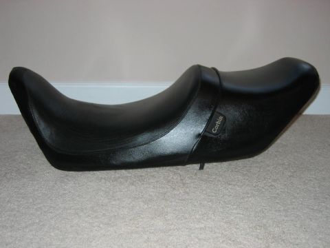 1985 Ford LTD Crown Victoria - A Corbin brand motorcycle seat is shown resting on a carpeted floor.