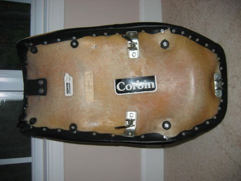 1985 Ford LTD Crown Victoria - The underside of a Corbin motorcycle seat shows its construction and mounting brackets.