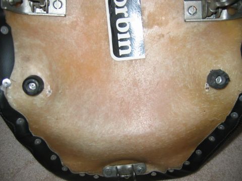 1985 Ford LTD Crown Victoria - Underside of a seat base a Corbin sticker and metal mounting hardware.