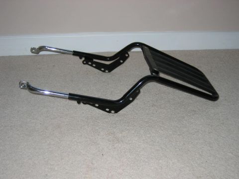 1985 Ford LTD Crown Victoria - Luggage rack with chrome mounting arms, likely for a motorcycle or vintage car.