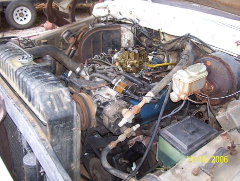 1978 Ford Bronco - Engine bay of an older Ford truck with the hood up and valve covers removed, dated 11/16/2006, exposing the intake manifold, gold-finish fo…
