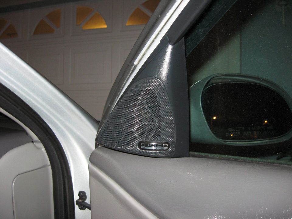 Mach audio speaker mounted on car door panel