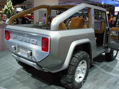 1996 Ford Bronco - Rear view of a silver concept SUV with a roll cage and exposed interior.